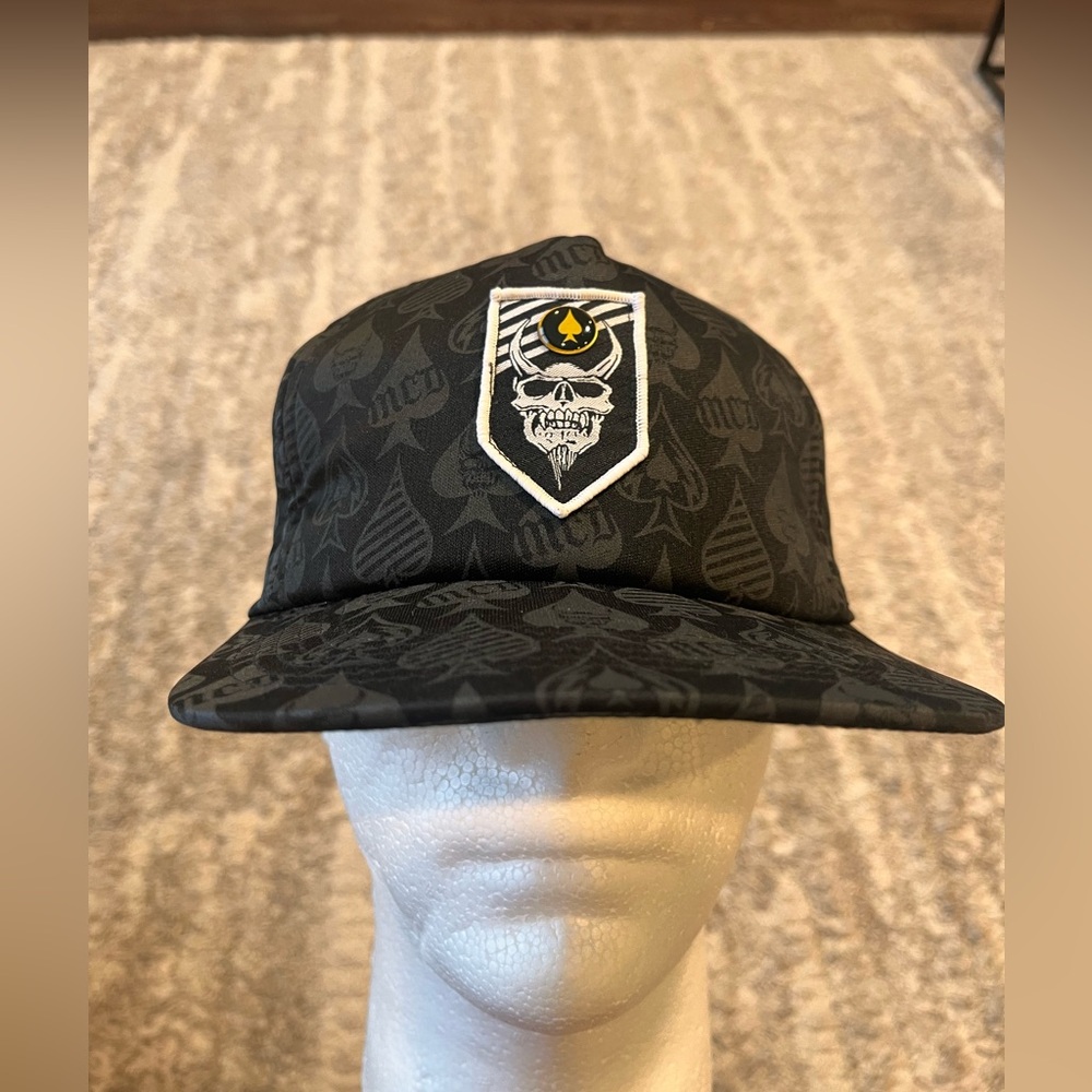 MCD  Black Patterned Cap with Skull Emblem